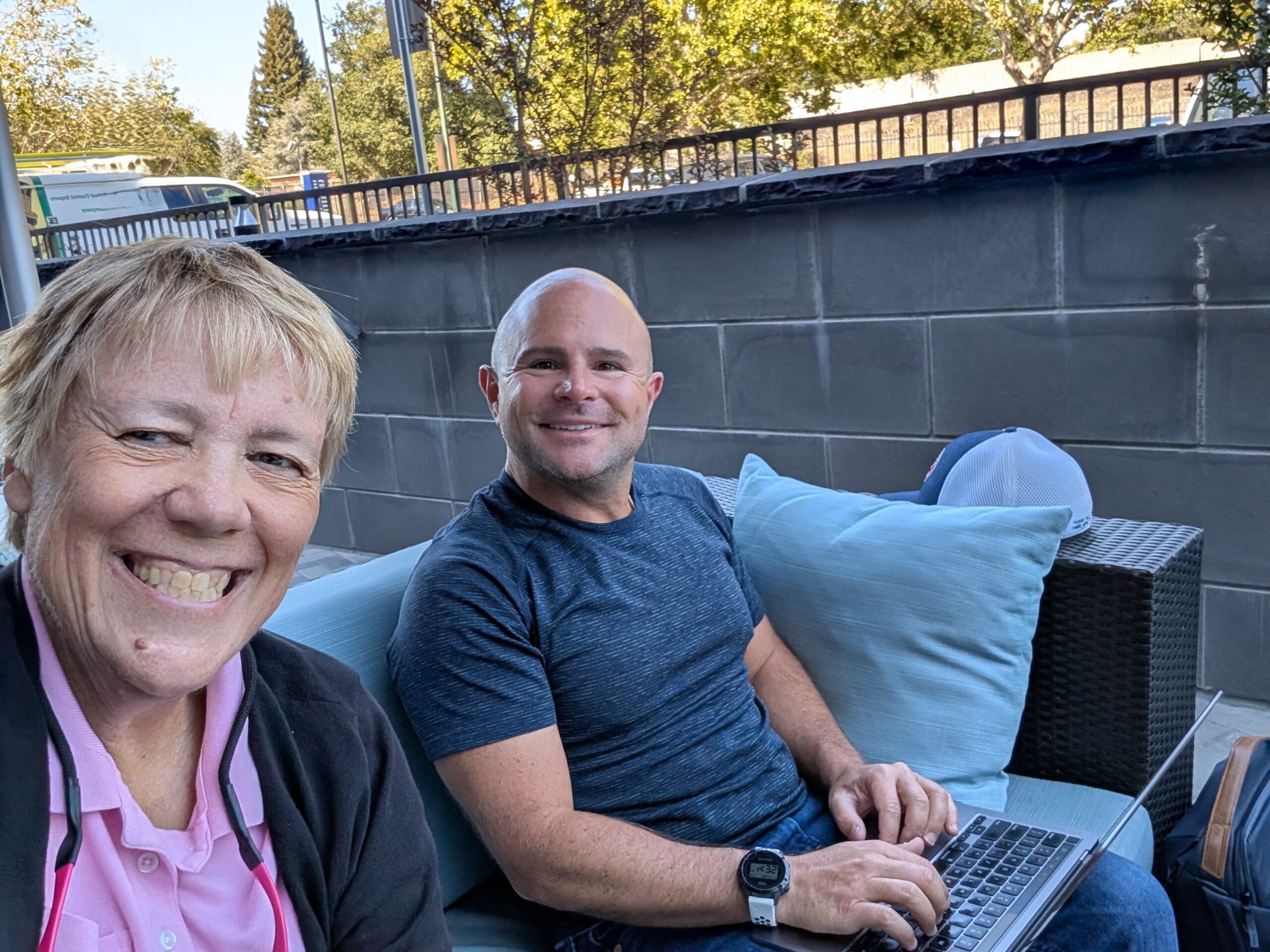 Precision Practices partners Genie Lutz and Ross Yellin working together with a laptop